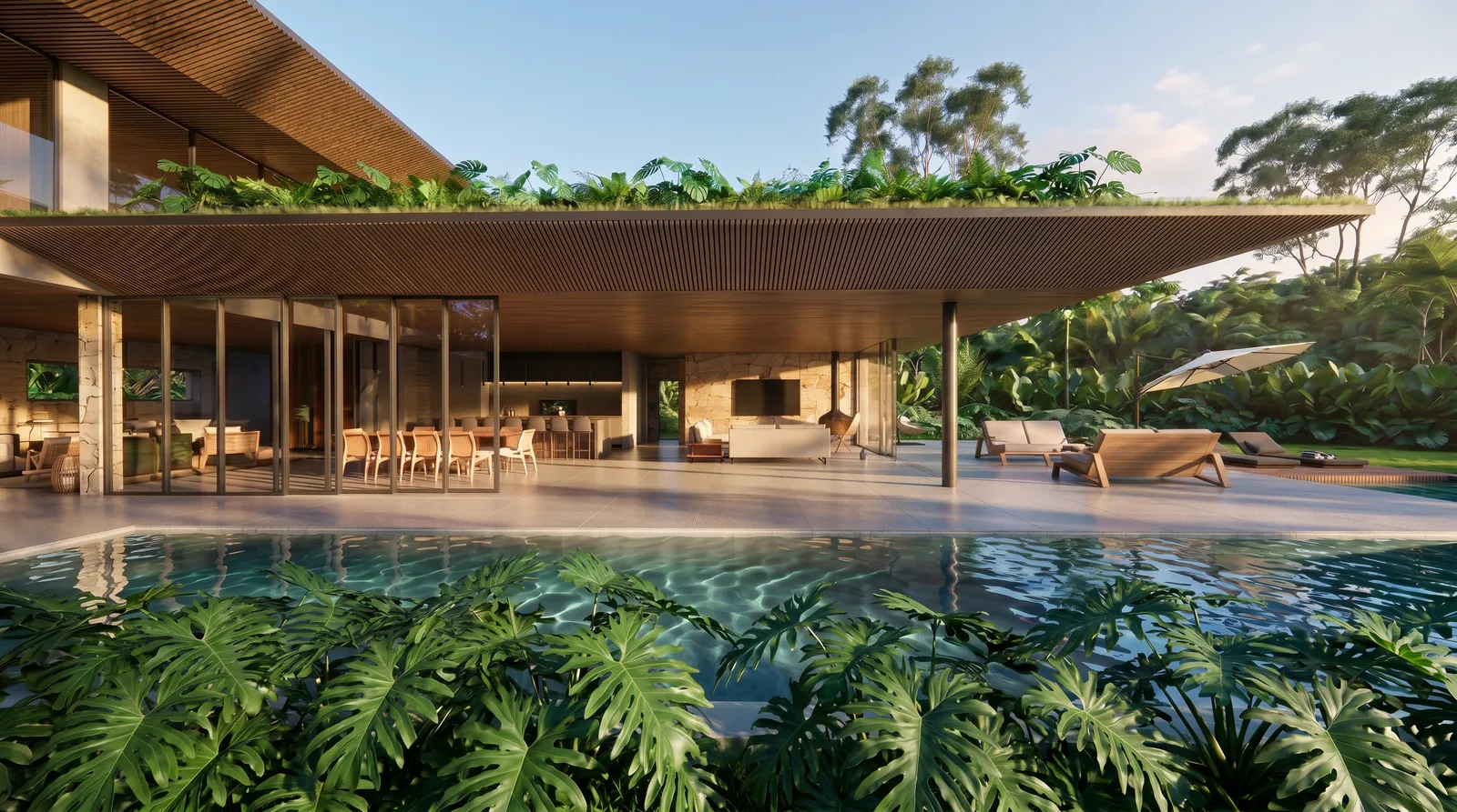 Cobertura em balanço da Casa Flabello com forro de madeira e teto verde, área social aberta para a piscina com deck molhado ao entardecer